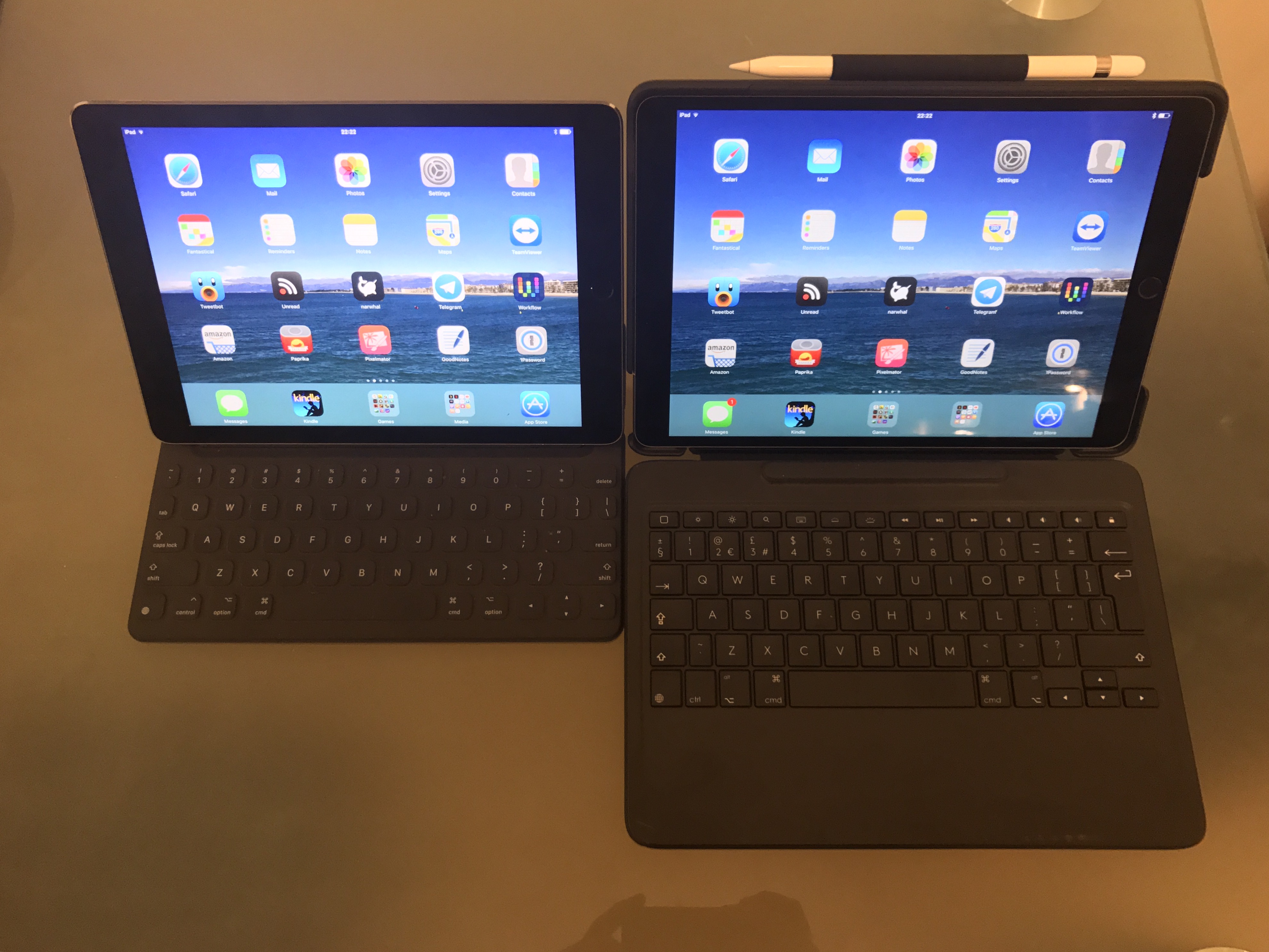 Two iPads side by side. One is in the Logitech case and one is attached to an Apple Smart Keyboard. The Logitech keyboard is about twice as deep as the Apple keyboard.