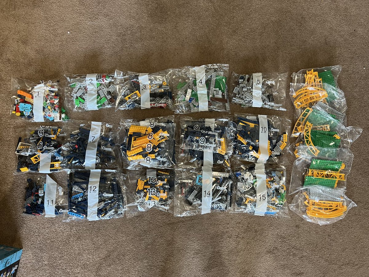 The same lego bags but organised by number into 16 piles