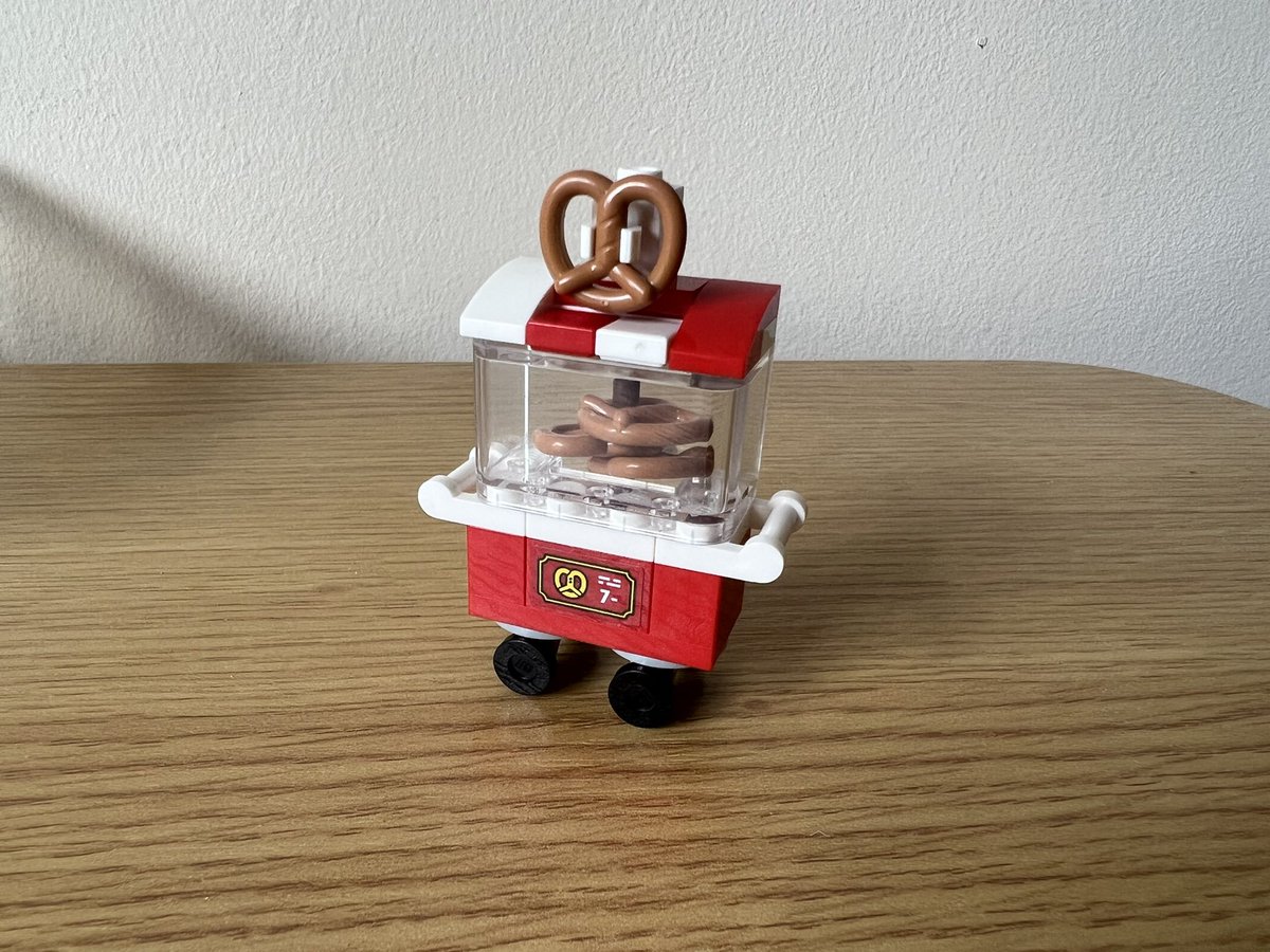 A lego pretzel cart. It’s red and white and there’s a pretzel sign on the roof.